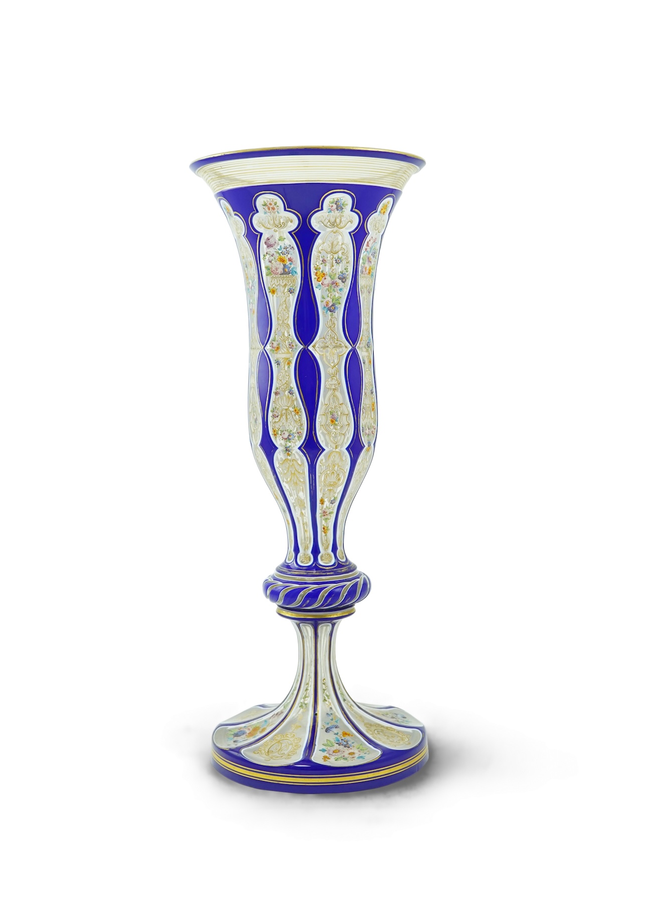 A tall 19th century Bohemian blue and white overlaid gilt and enamel decorated vase in the manner of Moser